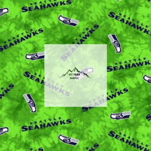 Great for any fan of Seattle Seahawks. This 100% flannel/cotton fabric is perfect for quilting, apparel, and many other sewing or crafting projects. This print features "Seattle Seahawks" and logo on a tie dye green background. Sold by the yard and half yard increments.